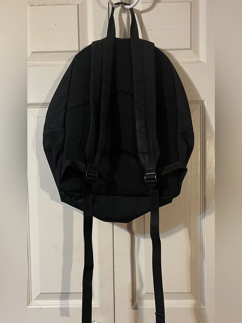Carhartt WIP Payton Backpack Black Rounded Silhouette White Embroidered Branding